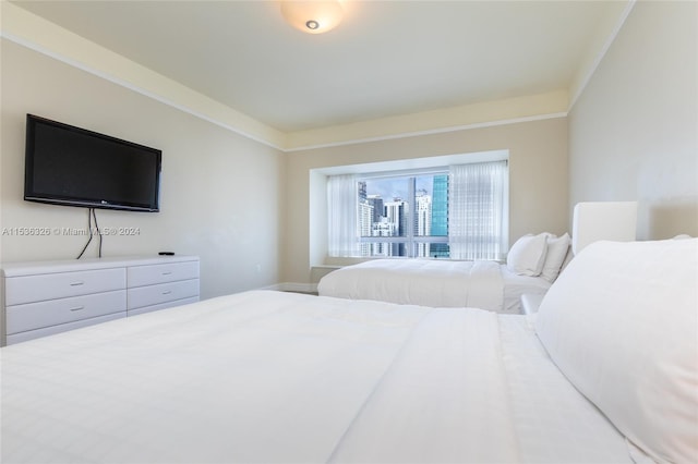 bedroom featuring ornamental molding