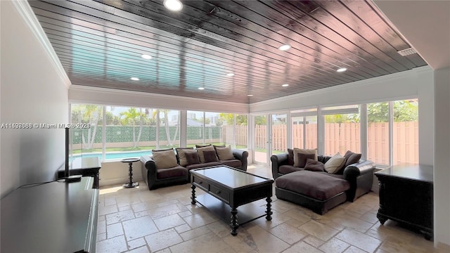 living room featuring light tile floors, wood ceiling, and crown molding