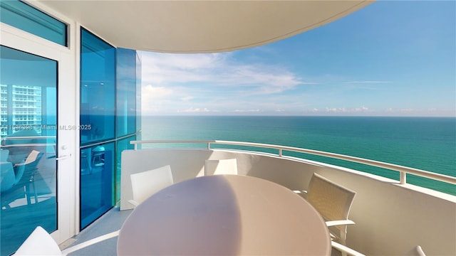 balcony featuring a water view