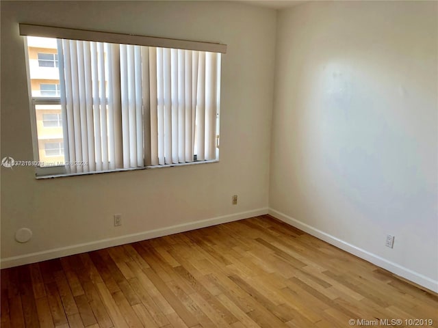 unfurnished room featuring light hardwood / wood-style flooring