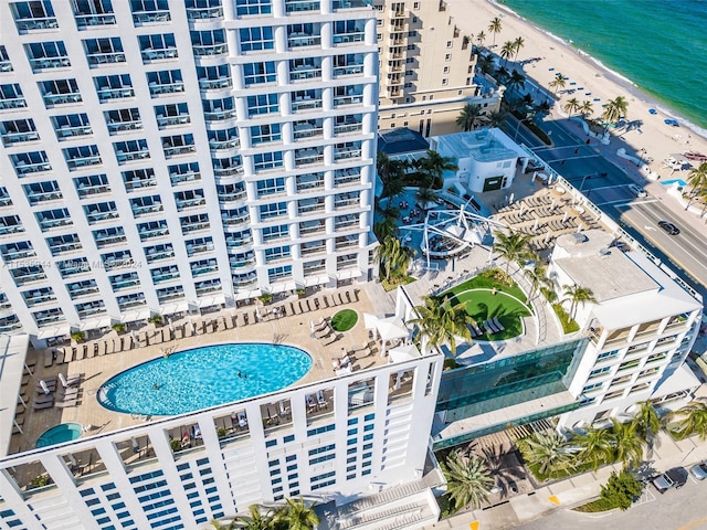 bird's eye view with a water view and a beach view