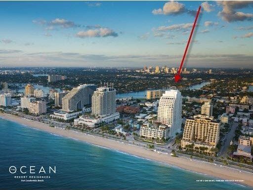 drone / aerial view featuring a view of the beach and a water view