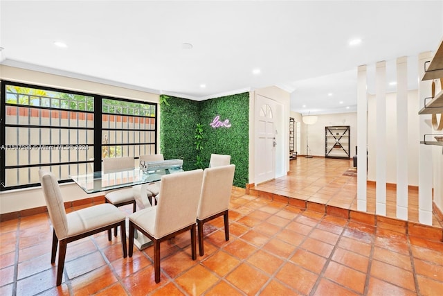 dining room with light tile floors and ornamental molding