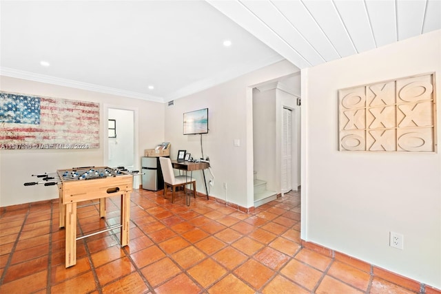 game room with crown molding and light tile floors