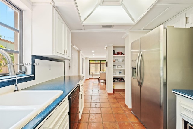 kitchen featuring stainless steel fridge, sink, light tile floors, white cabinets, and dishwasher