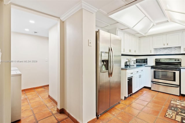 kitchen with light tile floors, white cabinets, and stainless steel appliances