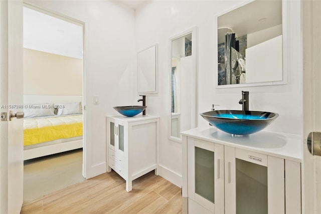 bathroom featuring vanity and hardwood / wood-style flooring