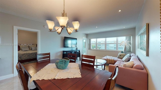 dining space with a notable chandelier and light tile patterned flooring