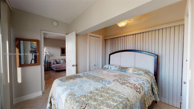 tiled bedroom featuring a closet