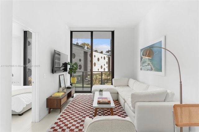 living area featuring floor to ceiling windows