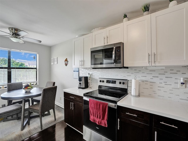 kitchen featuring ceiling fan, dark wood-type flooring, appliances with stainless steel finishes, backsplash, and dark brown cabinetry