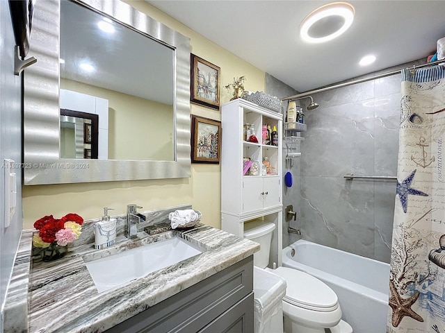 full bathroom with shower / bath combo with shower curtain, vanity, and toilet