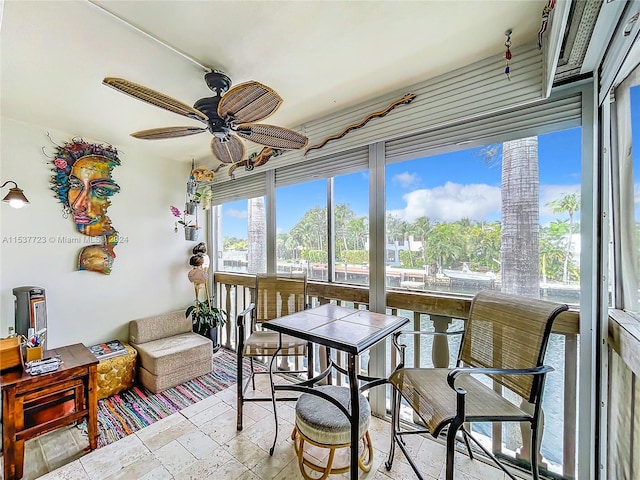 sunroom / solarium with ceiling fan