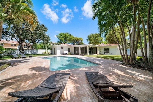 view of swimming pool with a patio