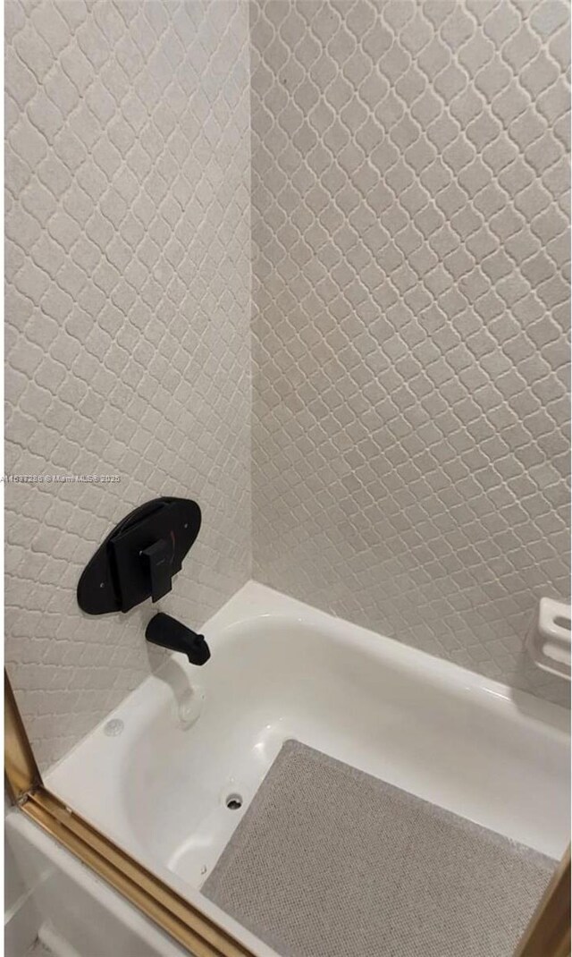 bathroom featuring vanity, backsplash, and toilet