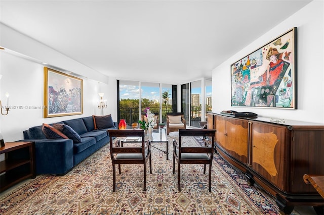 living room featuring floor to ceiling windows