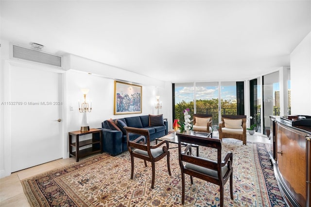 living room with light tile flooring and expansive windows