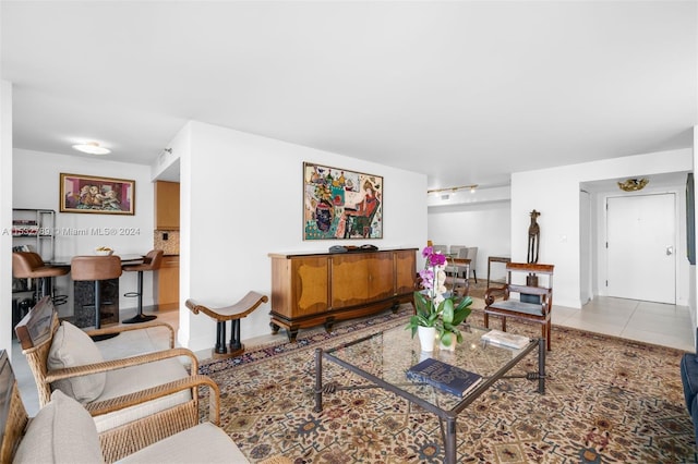 living room featuring light tile floors