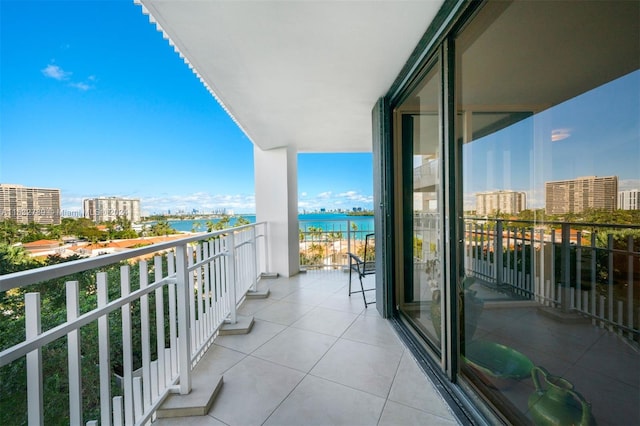 balcony featuring a water view