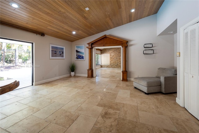 interior space featuring light tile floors, lofted ceiling, and wooden ceiling