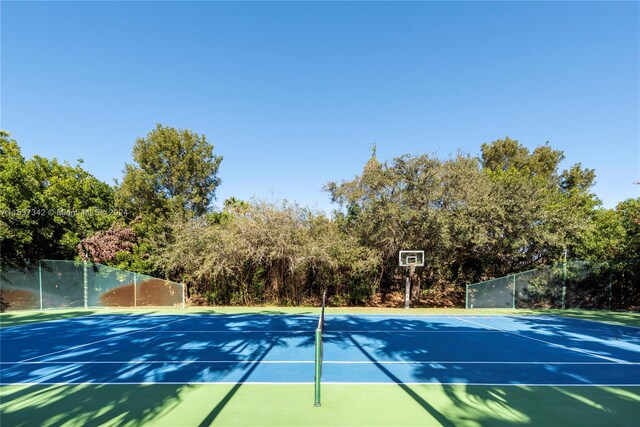 exterior space featuring basketball hoop