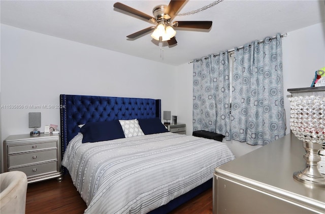 bedroom with ceiling fan and dark hardwood / wood-style flooring