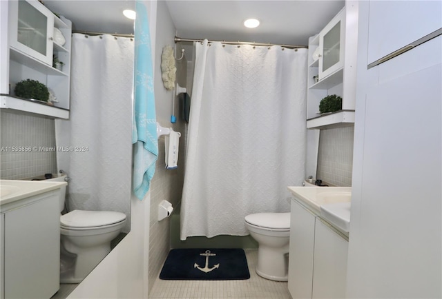 bathroom with vanity, toilet, and tile patterned floors