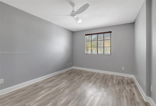 unfurnished room featuring light hardwood / wood-style floors and ceiling fan