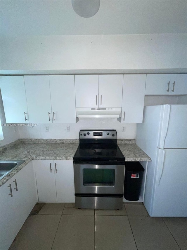 kitchen featuring white fridge, electric stove, white cabinetry, and sink