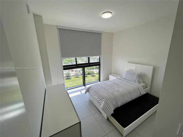 bedroom with light tile patterned flooring