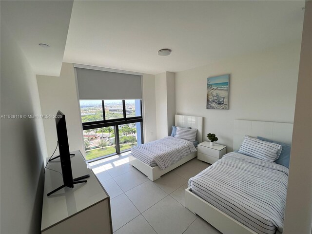 bedroom featuring light tile patterned flooring