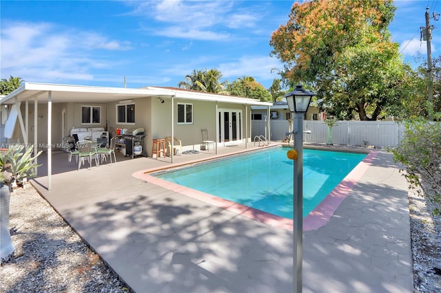 view of swimming pool featuring a patio