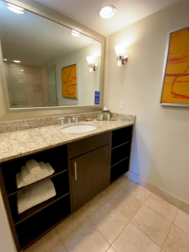 bathroom featuring vanity and tile patterned flooring