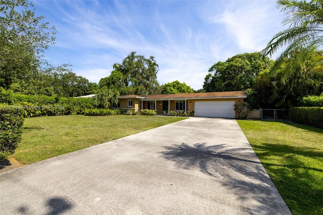 ranch-style home with a front yard and a garage