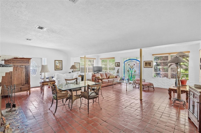 dining space featuring a textured ceiling