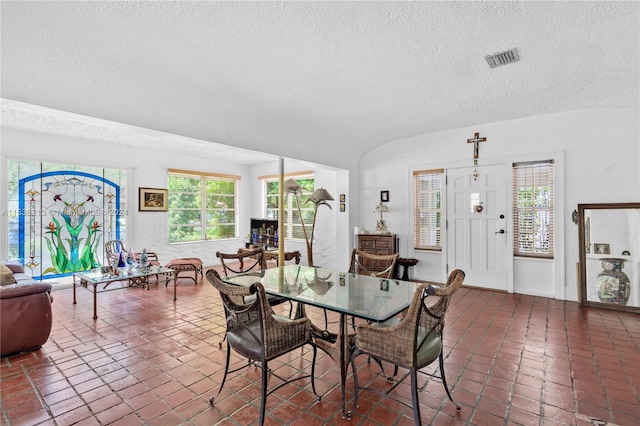 dining room with a textured ceiling