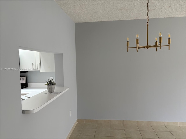 12755 SW 16th Ct Unit 211B, Pembroke Pines, FL 33027 - dining area with a textured ceiling, a chandelier, and light tile patterned floors