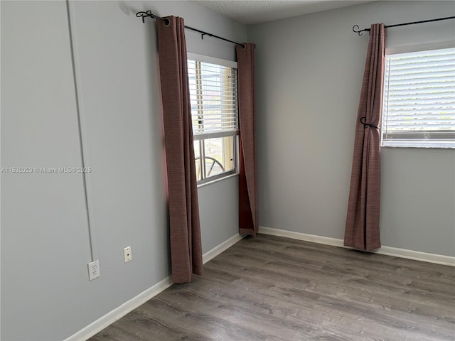 12755 SW 16th Ct Unit 211B, Pembroke Pines, FL 33027 - unfurnished room with wood finished floors and baseboards