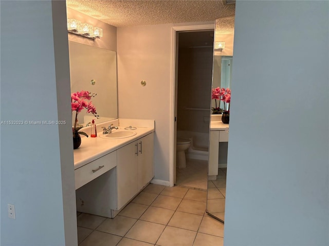 12755 SW 16th Ct Unit 211B, Pembroke Pines, FL 33027 - bathroom featuring toilet, vanity, tile patterned floors, and a textured ceiling