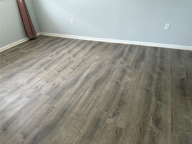 12755 SW 16th Ct Unit 211B, Pembroke Pines, FL 33027 - empty room with baseboards and wood finished floors