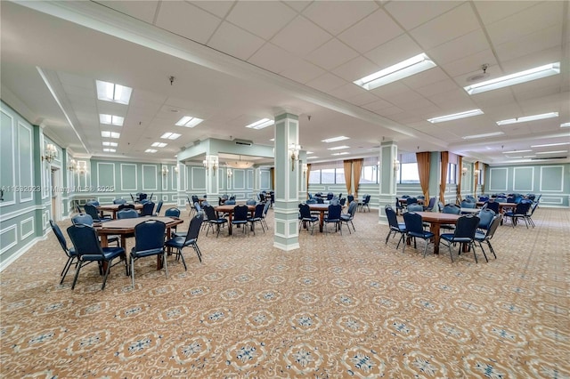 12755 SW 16th Ct Unit 211B, Pembroke Pines, FL 33027 - dining area featuring a decorative wall, carpet flooring, a paneled ceiling, and ornate columns