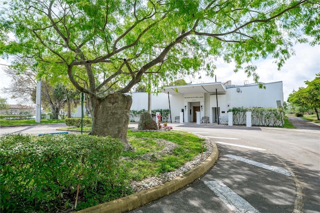 12755 SW 16th Ct Unit 211B, Pembroke Pines, FL 33027 - view of front of house with stucco siding and uncovered parking