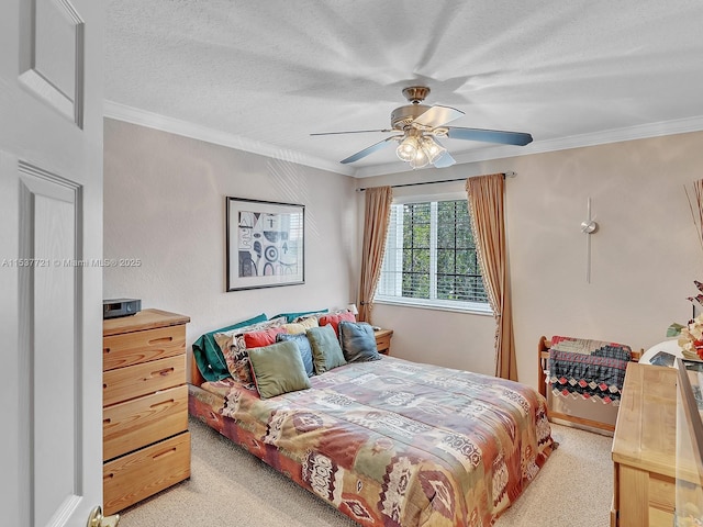 bedroom with light carpet, ceiling fan, a textured ceiling, and crown molding