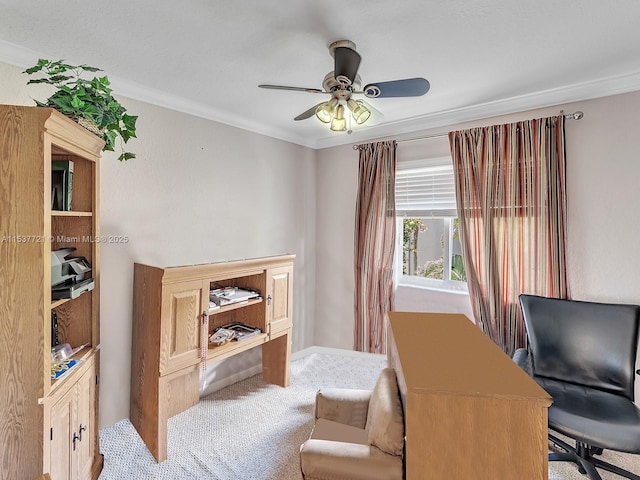 home office with light carpet, ceiling fan, and crown molding