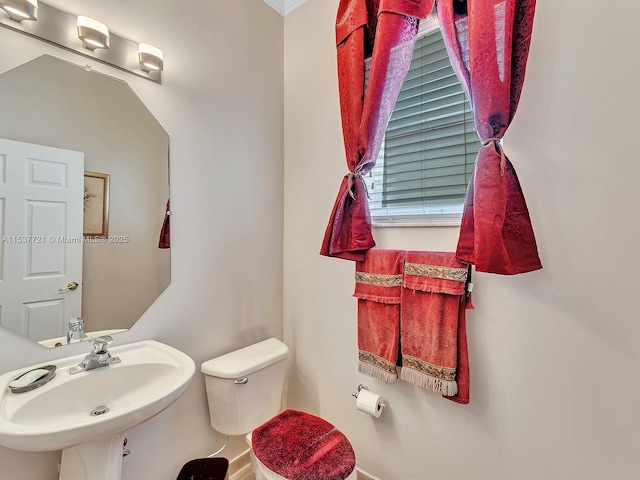 bathroom with toilet and a sink