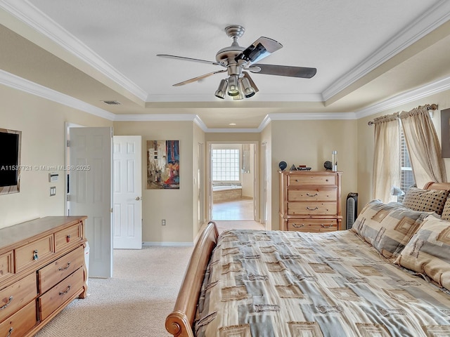 bedroom featuring ornamental molding, a raised ceiling, visible vents, and light carpet