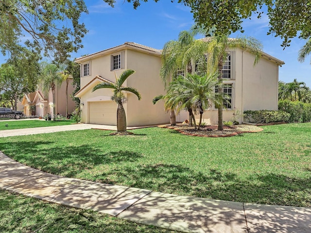 mediterranean / spanish-style house featuring driveway, stucco siding, an attached garage, and a front yard