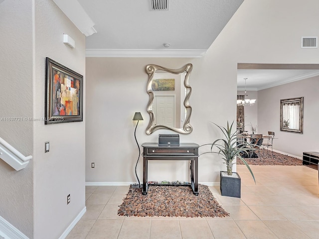 corridor featuring ornamental molding, visible vents, baseboards, and light tile patterned floors