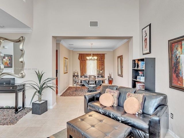 living room with ornamental molding, visible vents, baseboards, and light tile patterned floors