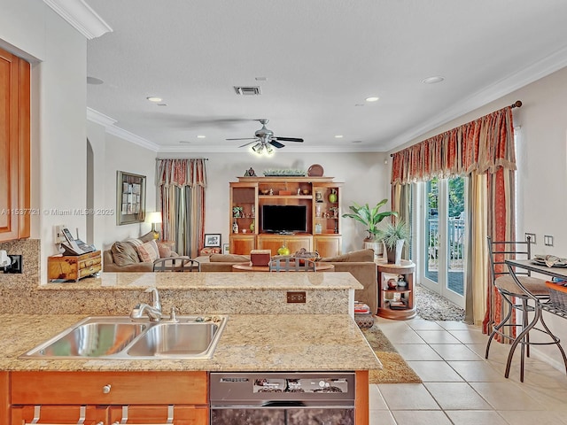 kitchen with dishwashing machine, light tile patterned flooring, a sink, visible vents, and open floor plan